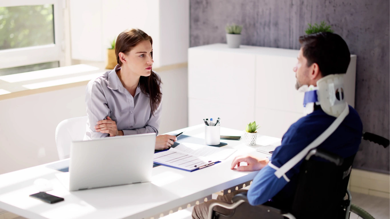 an injured man talking to a healthcare lawyer
